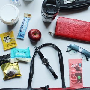 Flat lay black tote and snacks