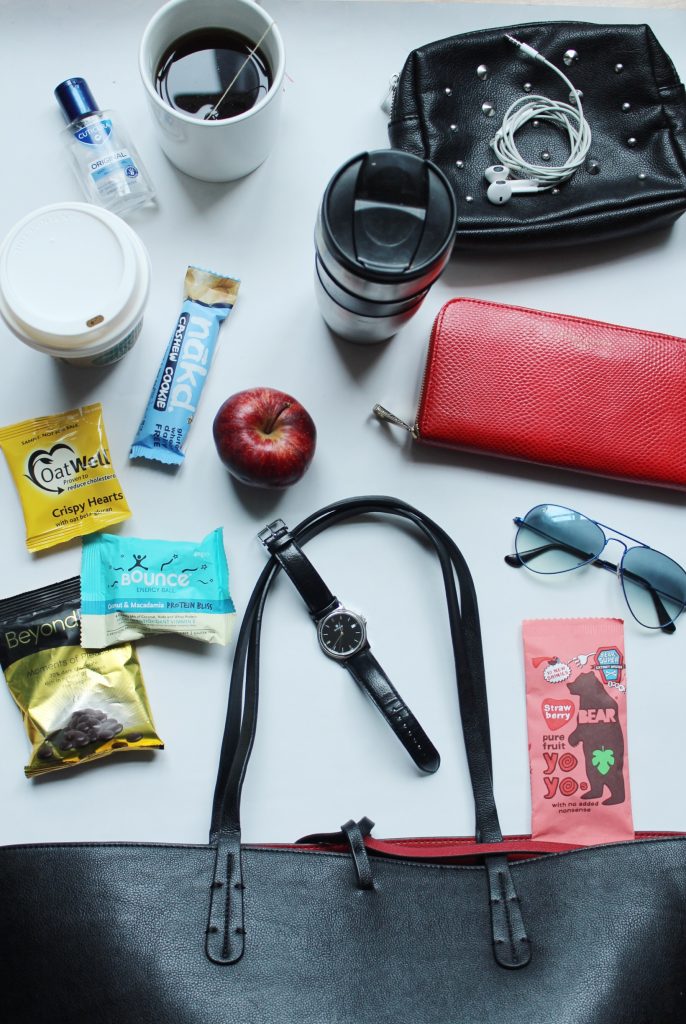 Flat lay black tote and snacks