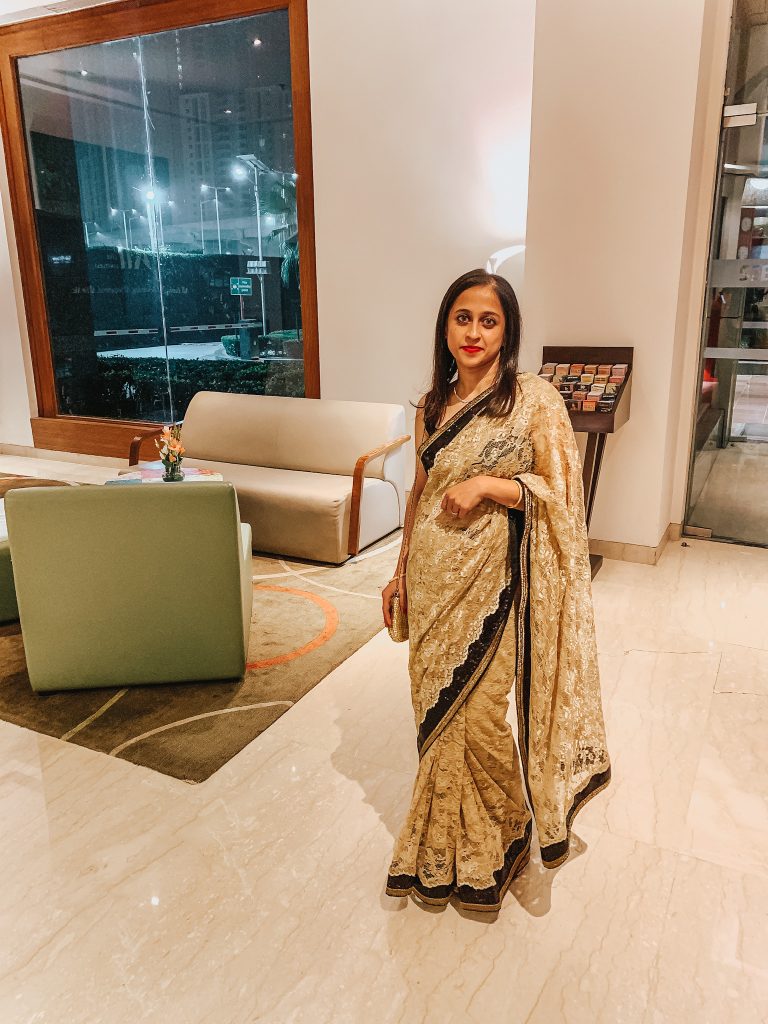 Gold lace and black sequin sari wedding season