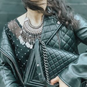 Black Chanel boy bag and quilted leather jacket